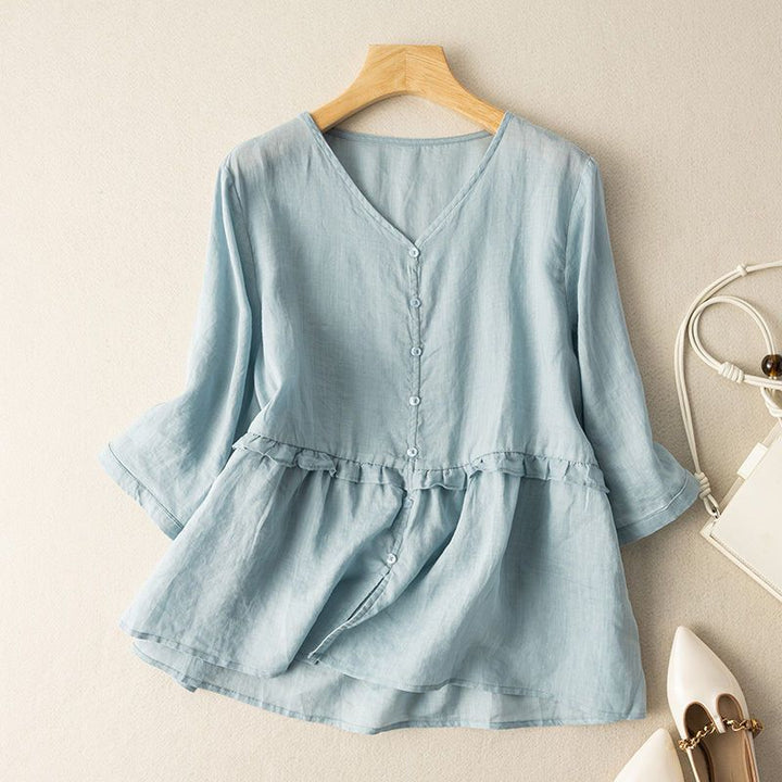 Women's flowy button-down blouse with comfortable three-quarter sleeves, perfect for stylish casual summer wear.