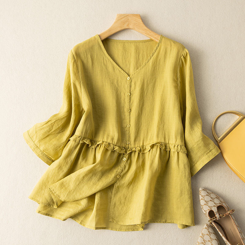 Elegant women's flowy button-down blouse with ruffled three-quarter sleeves; a stylish and comfortable spring top.
