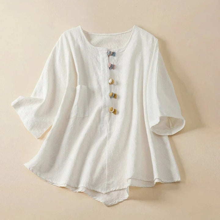 Chic women's flowy button-down blouse with stylish knotted details. A versatile long-sleeve top for casual or elegant wear.