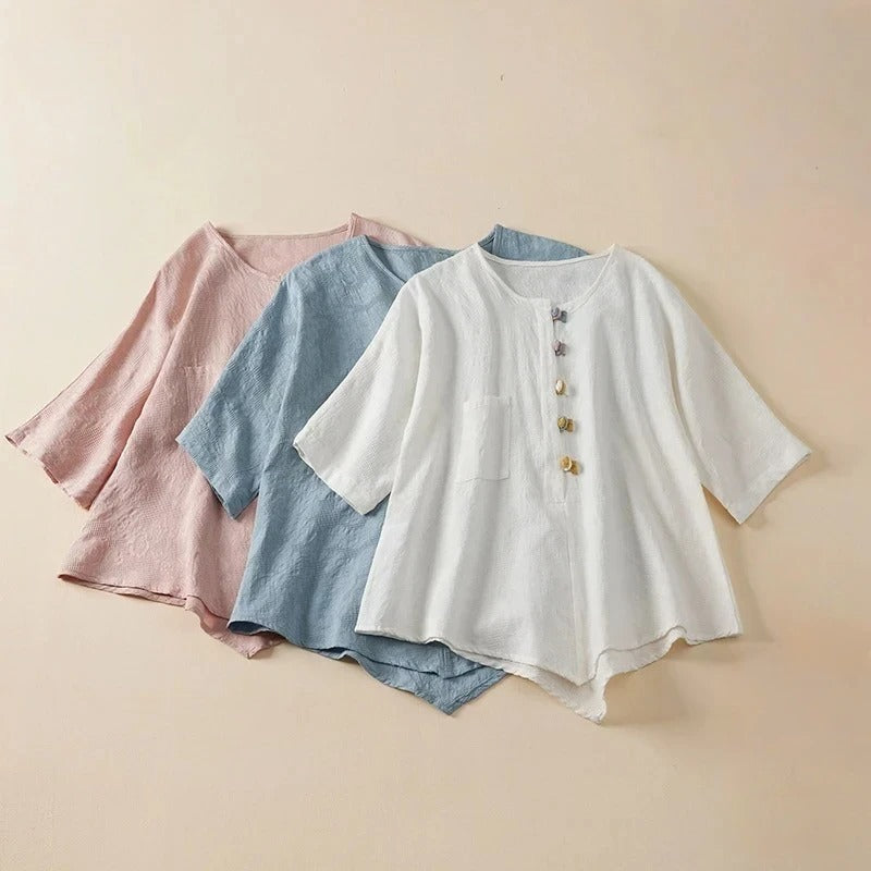 Stylish women's long-sleeve button-down shirt with a flowy fit and unique knotted button details. Modern casual blouse.