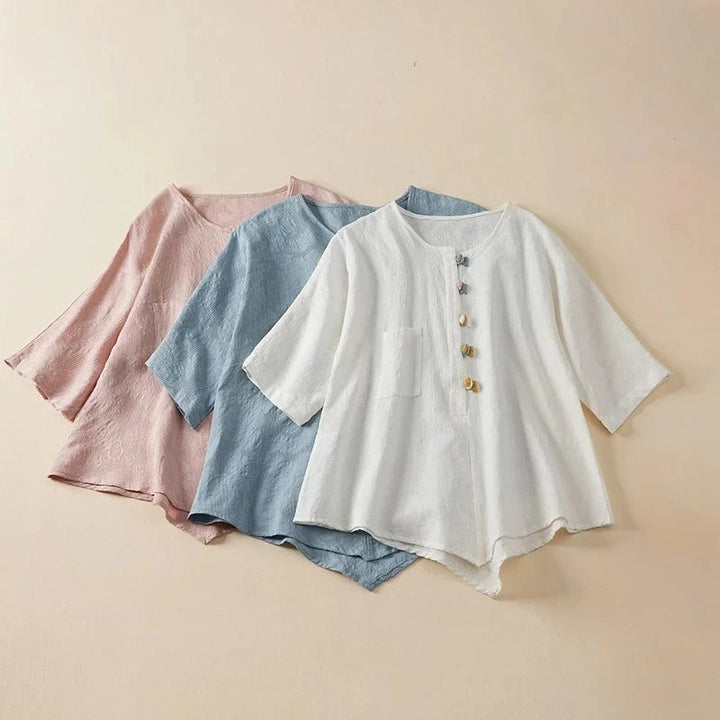 Stylish women's long-sleeve button-down shirt with a flowy fit and unique knotted button details. Modern casual blouse.