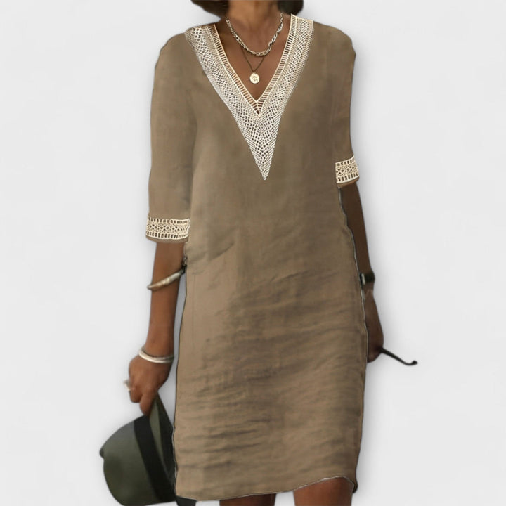 Stylish women's flowy midi crochet dress featuring delicate openwork, great for a relaxed summer or elegant beach look.