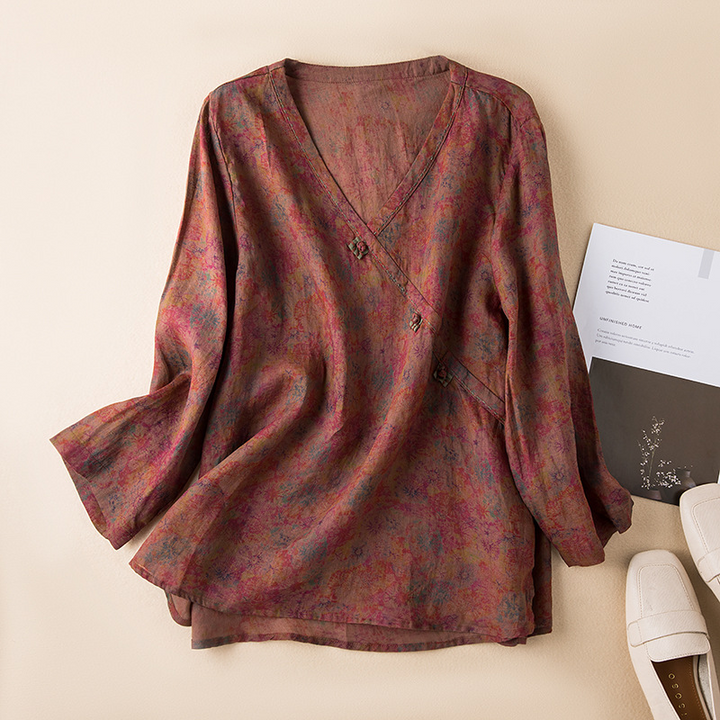 Patterned women's flowy crossover blouse featuring a delicate print & stylish bohemian design.