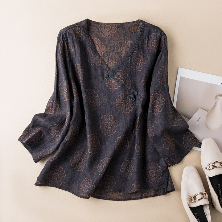 Casual women's flowy crossover top with delicate print; a versatile and airy blouse for spring.