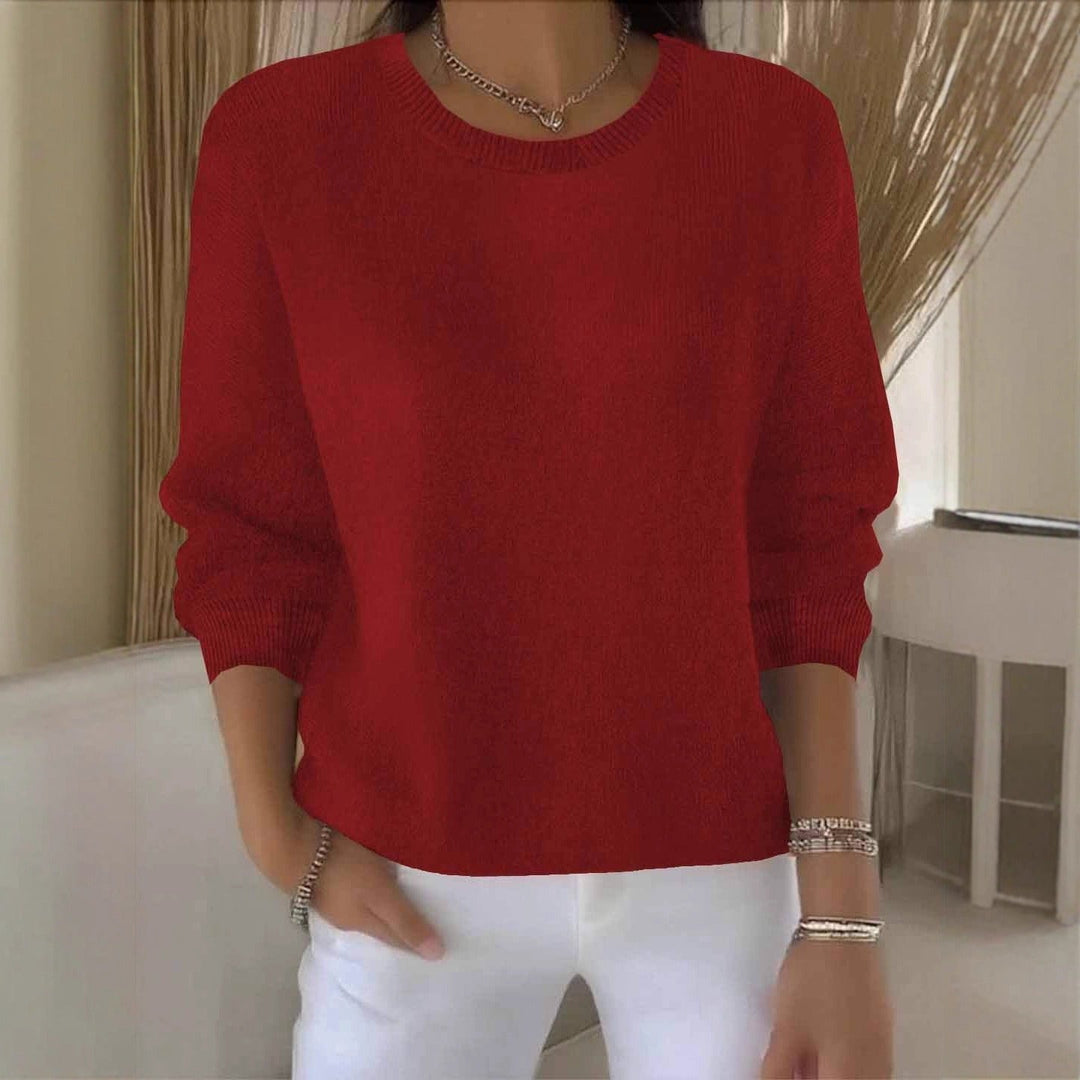Women's flowy fit sweater in a versatile design for comfortable, chic everyday wear.