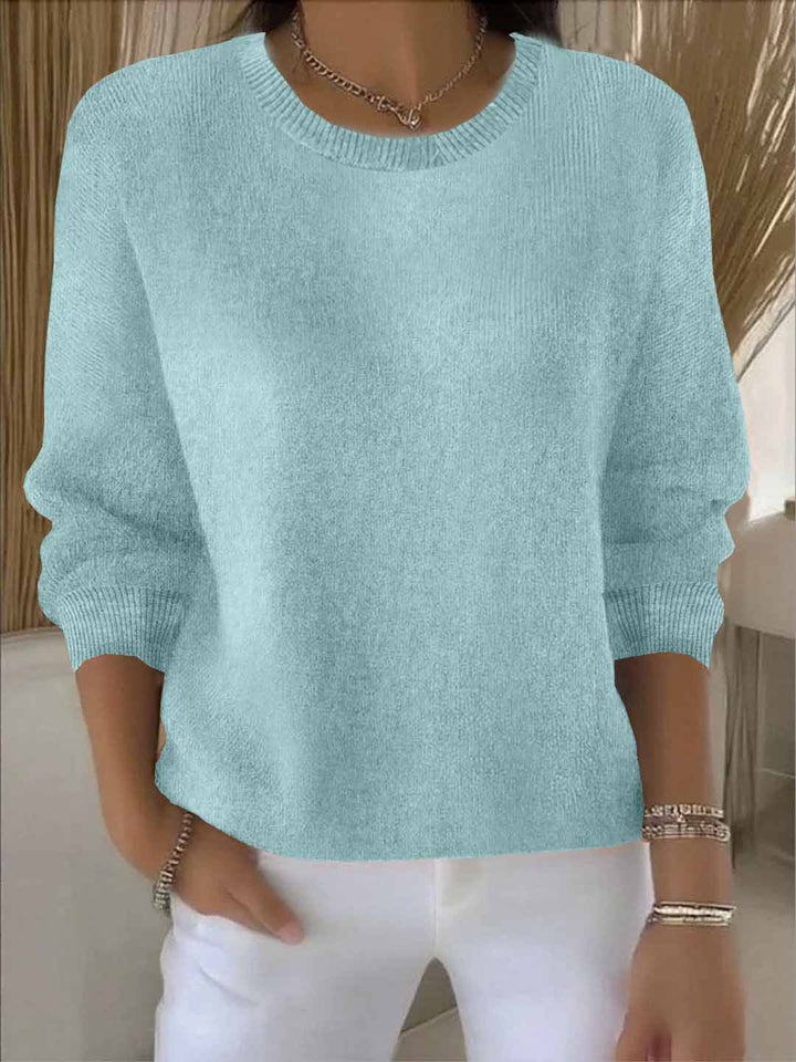 Soft touch women's flowy sweater, a cozy relaxed fit top for ultimate comfort and style.