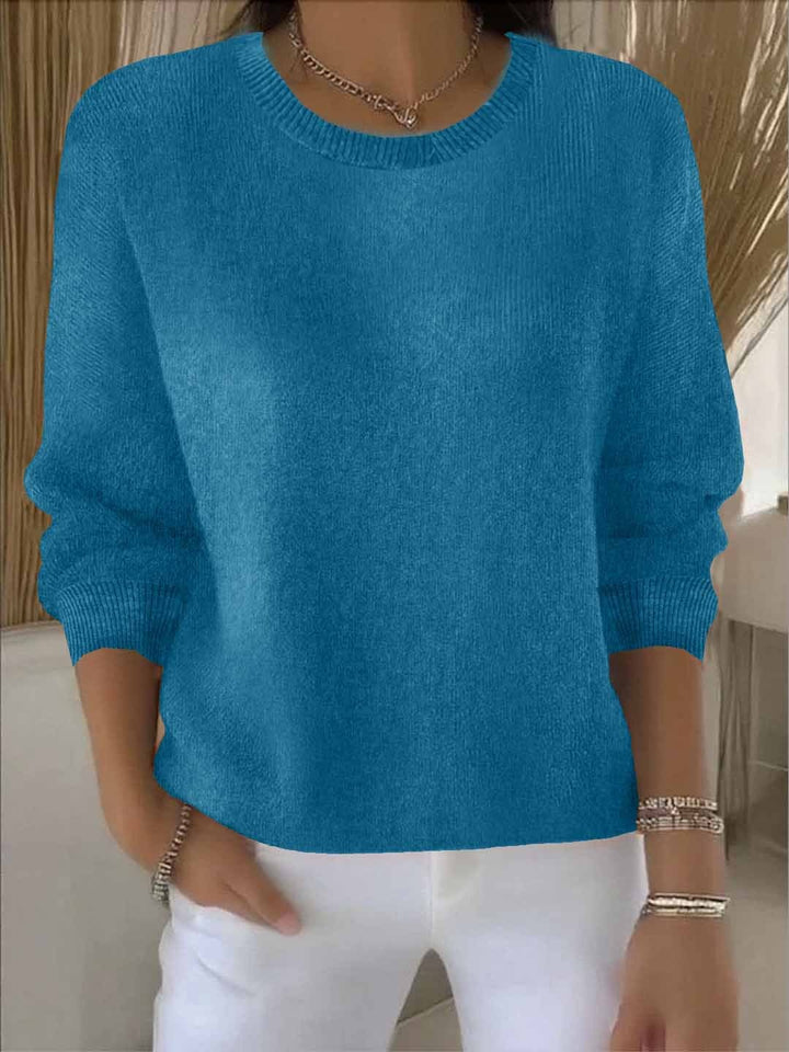 Women's flowy long sleeve sweater, combining versatile comfort with chic style for any occasion.