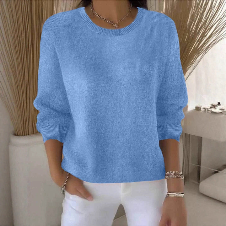 Women's flowy fit sweater, a comfortable and stylish long sleeve top for versatile everyday fashion.