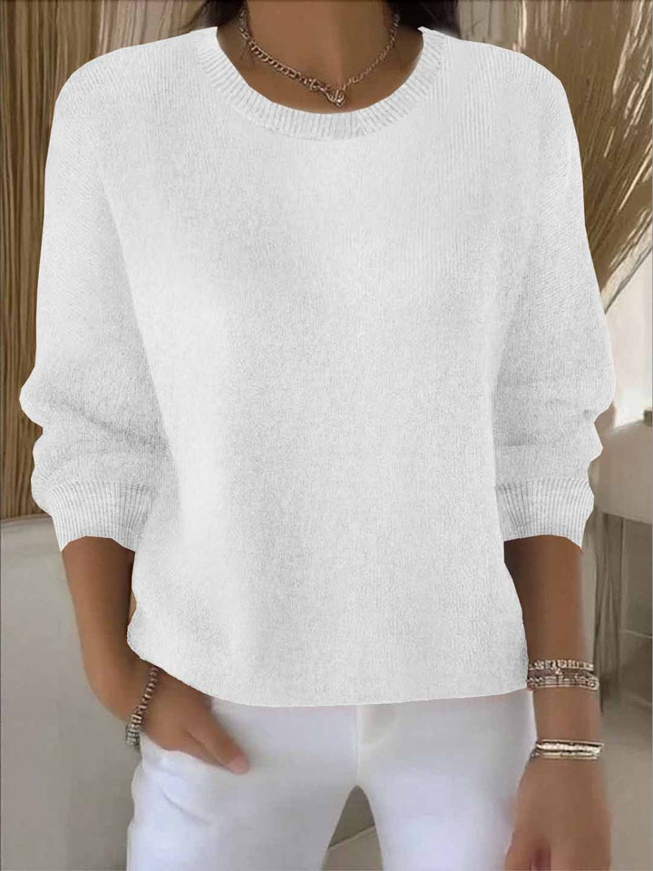 Versatile women's flowy long sleeve sweater, ideal as a comfortable layering piece for any season.