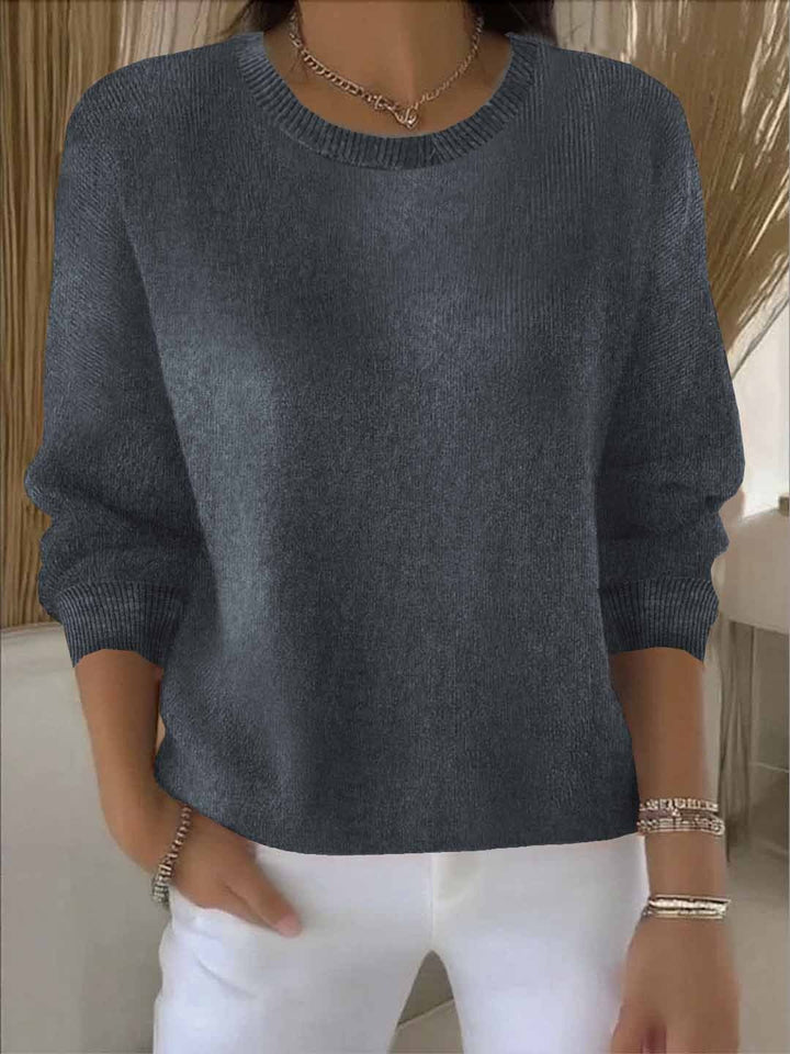 Soft winter women's flowy sweater, a cozy long sleeve top for comfortable cold-weather style.