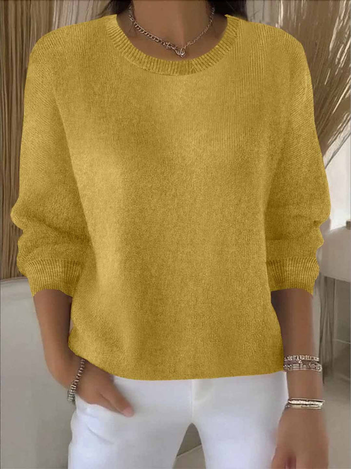 Elegant women's flowy top, a comfortable long sleeve sweater with a relaxed, chic silhouette.