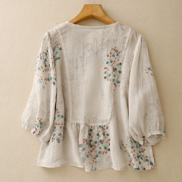 Bohemian style women's flowy floral blouse. This long sleeve, relaxed fit top offers feminine summer fashion.