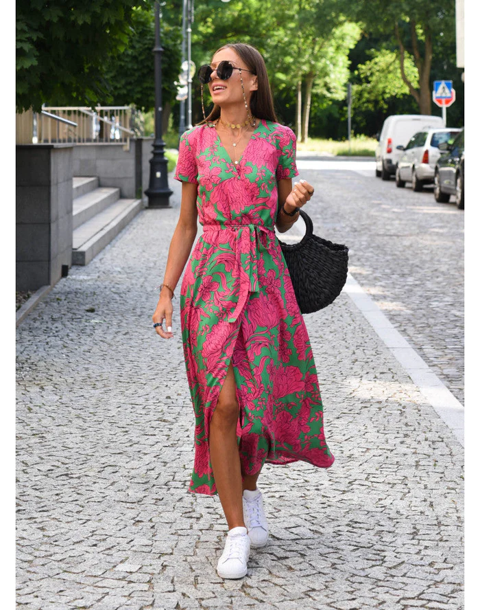 Women's flowy floral maxi dress, perfect for summer, beach, or casual wear. Vibrant short sleeve design.