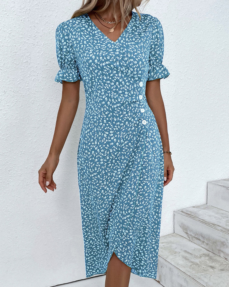 Detail of the vibrant floral print and elegant V-neck on a women's flowy summer maxi dress.