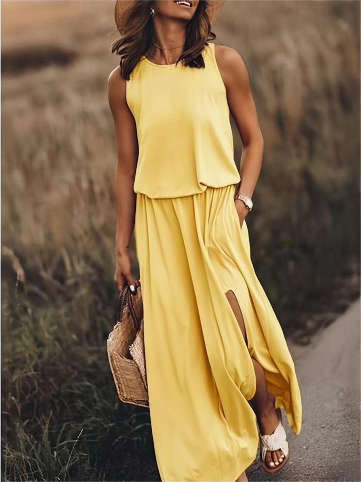 Women's flowy maxi dress with elastic waist & pockets. Perfect for summer, vacation, or casual wear.