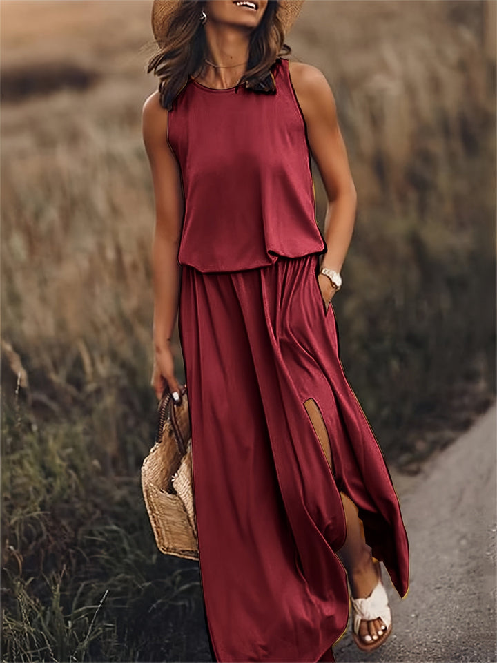 Sleeveless women's maxi dress, a versatile flowy summer dress with an elastic waist, pockets & long skirt.