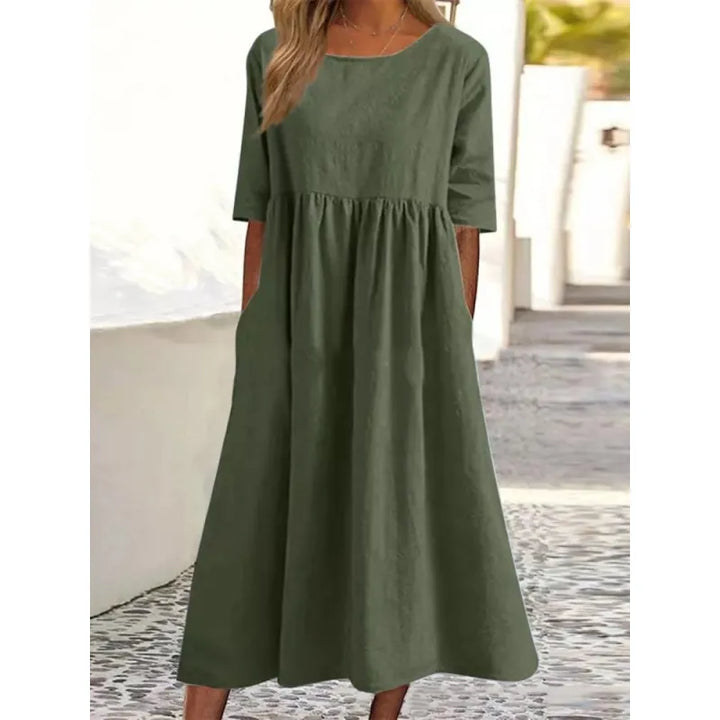 Women's flowy maxi dress with practical pockets and comfortable half sleeves, perfect for casual everyday wear.