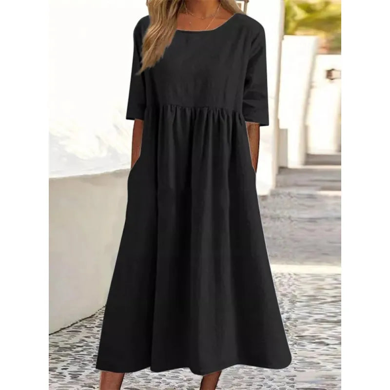 Elegant women's flowy maxi dress featuring a round neck and half sleeves, ideal for spring & summer fashion.