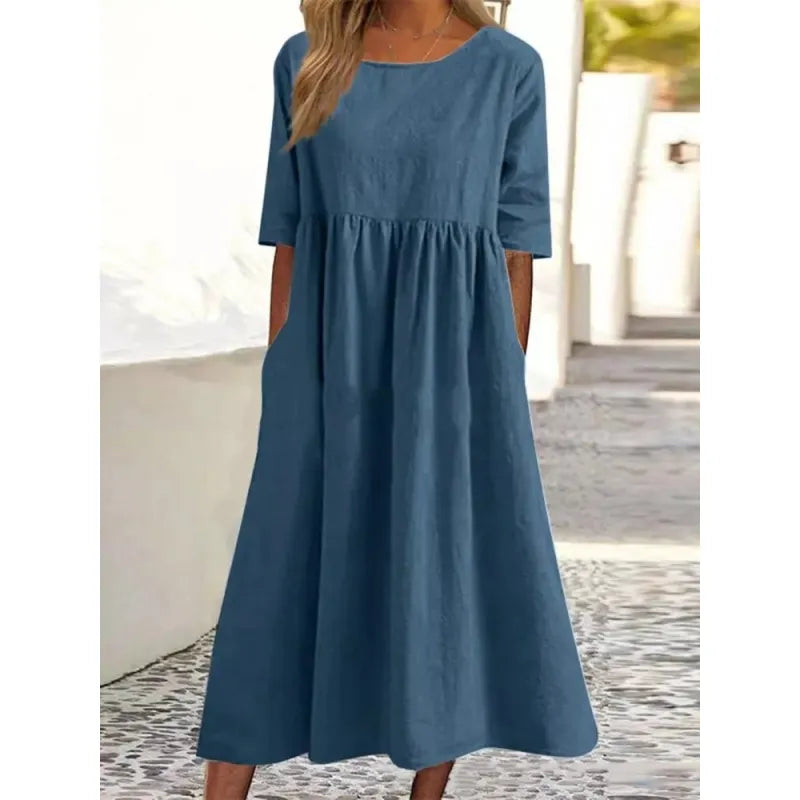 Casual women's maxi dress with convenient pockets and stylish half sleeves, great for all-day comfort.