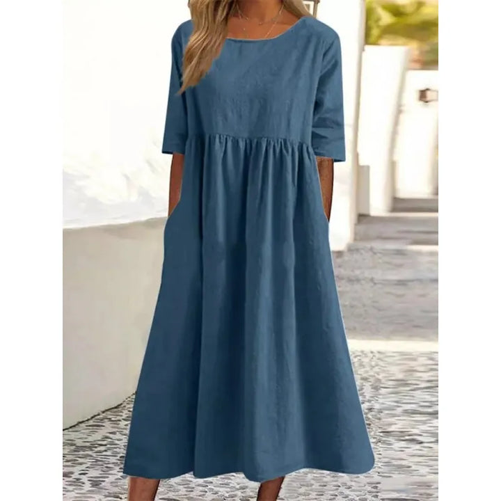 Casual women's maxi dress with convenient pockets and stylish half sleeves, great for all-day comfort.