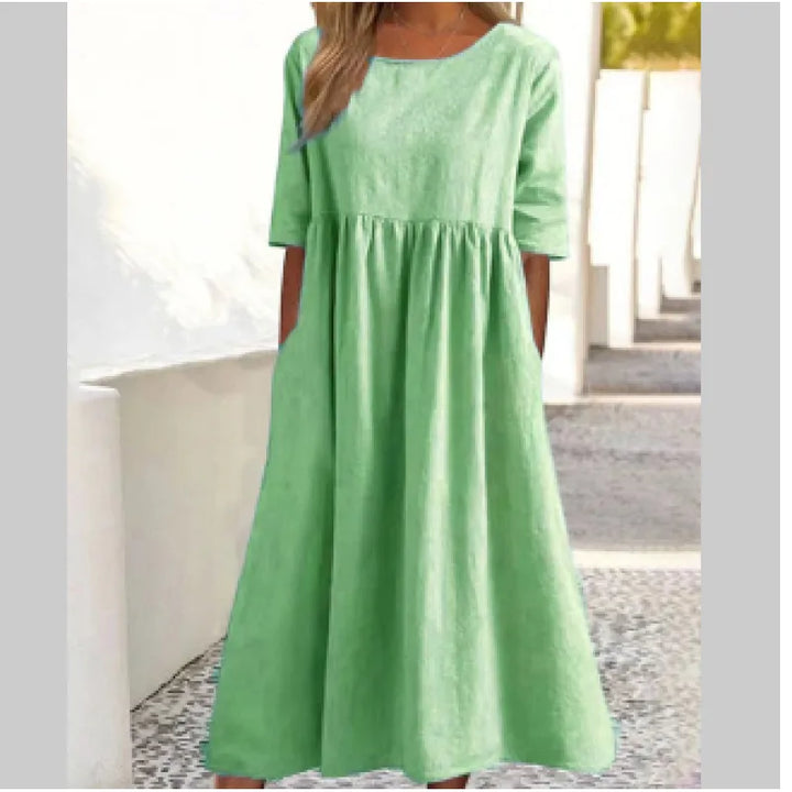 Comfortable women's flowy maxi dress with half sleeves and pockets, designed for effortless everyday style.