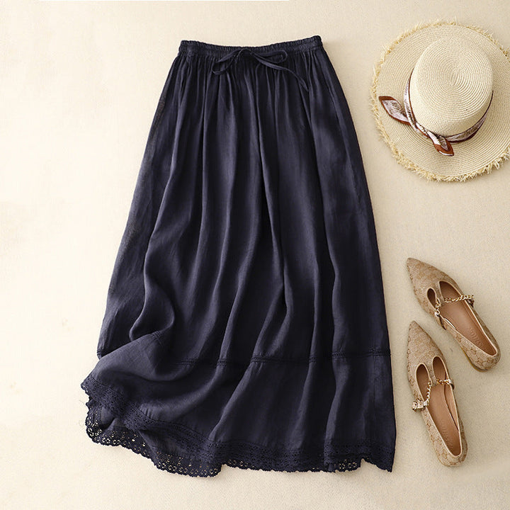 Stylish women's flowy maxi skirt with intricate lace trim. Versatile for casual or elegant summer looks.