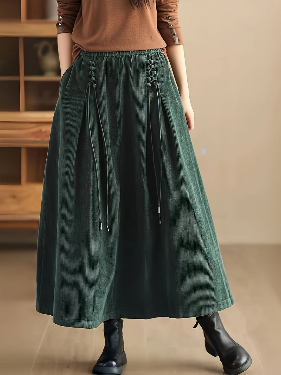 Women's flowy maxi skirt with stylish corset-style waist, perfect for elegant or casual looks.