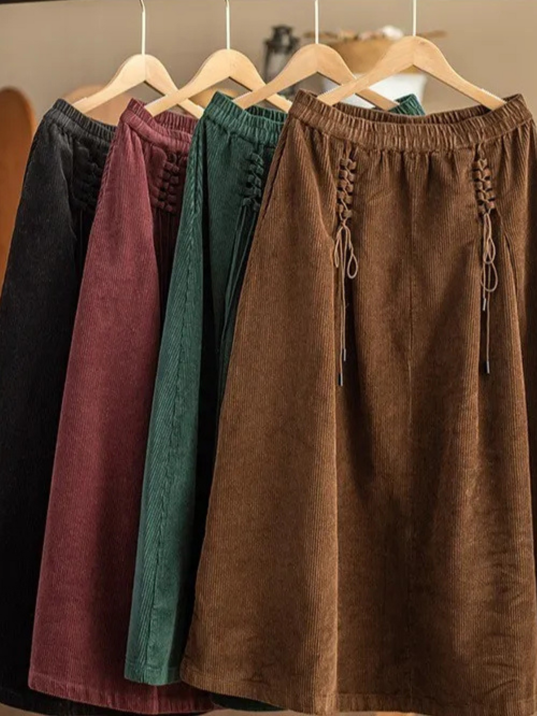 Close-up: Stylish corset-style waist detail on a women's flowy long maxi skirt, emphasizing uniqueness.