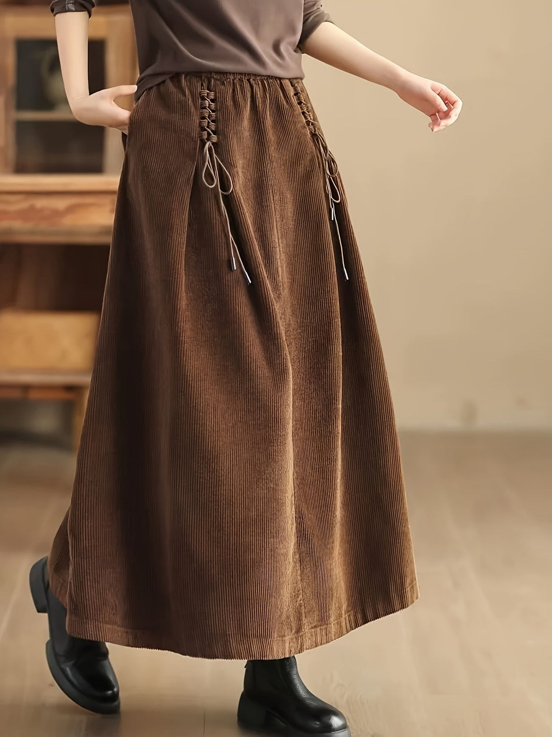 Versatile brown women's long maxi skirt with a flattering corset waist and convenient pockets.