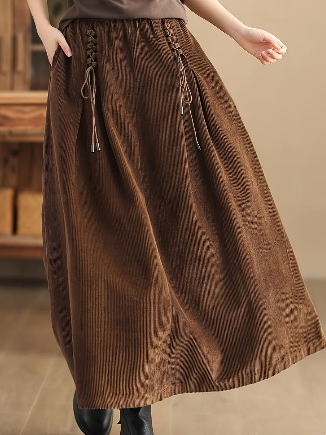 Chic black flowy maxi skirt for women, featuring a corset-style waist, ideal for casual or elegant wear.