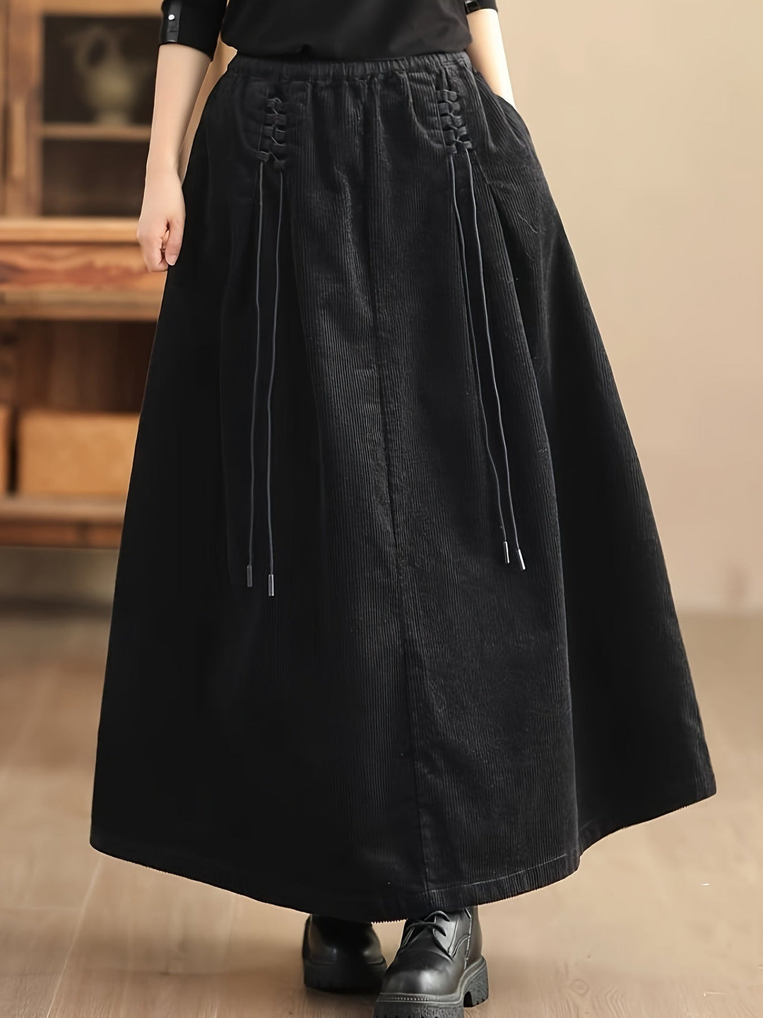 Burgundy stretch maxi skirt with a comfortable corset waist, offering flowy elegance for women.