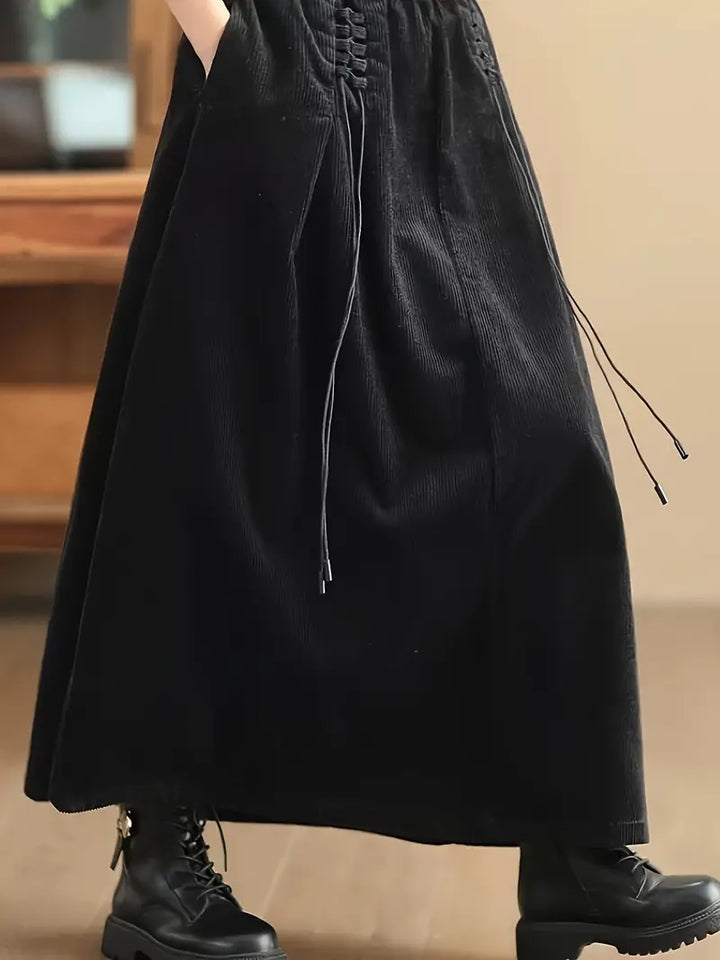 Women's A-line flowy maxi skirt, designed with a trendy corset-style waist for a flattering silhouette.