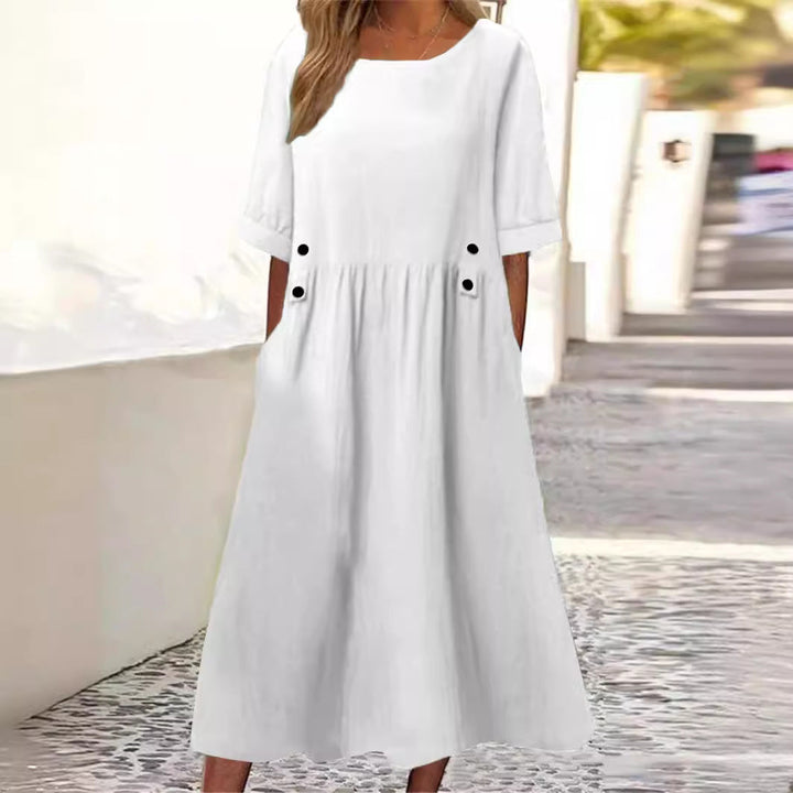 Relaxed fit women's summer midi dress. Flowy mid-length style for comfortable everyday wear.