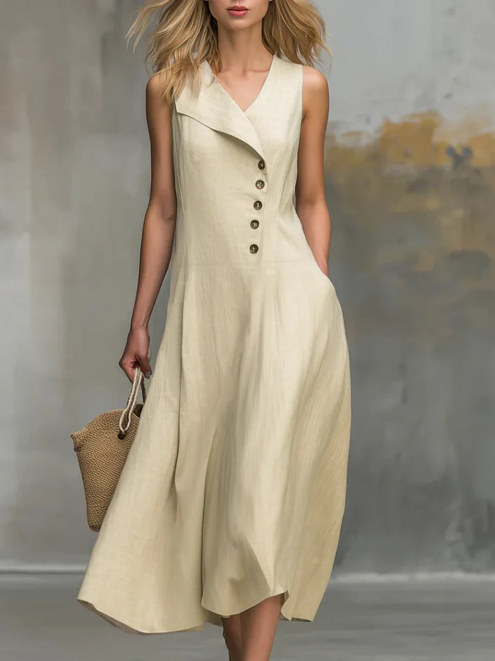 Women's flowy midi dress with button details, V-neck, and relaxed fit. Perfect for elegant everyday style.
