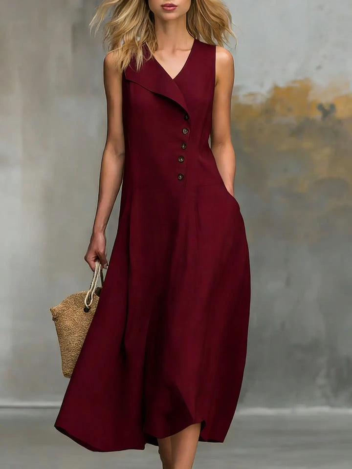 Elegant women's sleeveless flowy midi dress with chic button details and a comfortable relaxed fit.