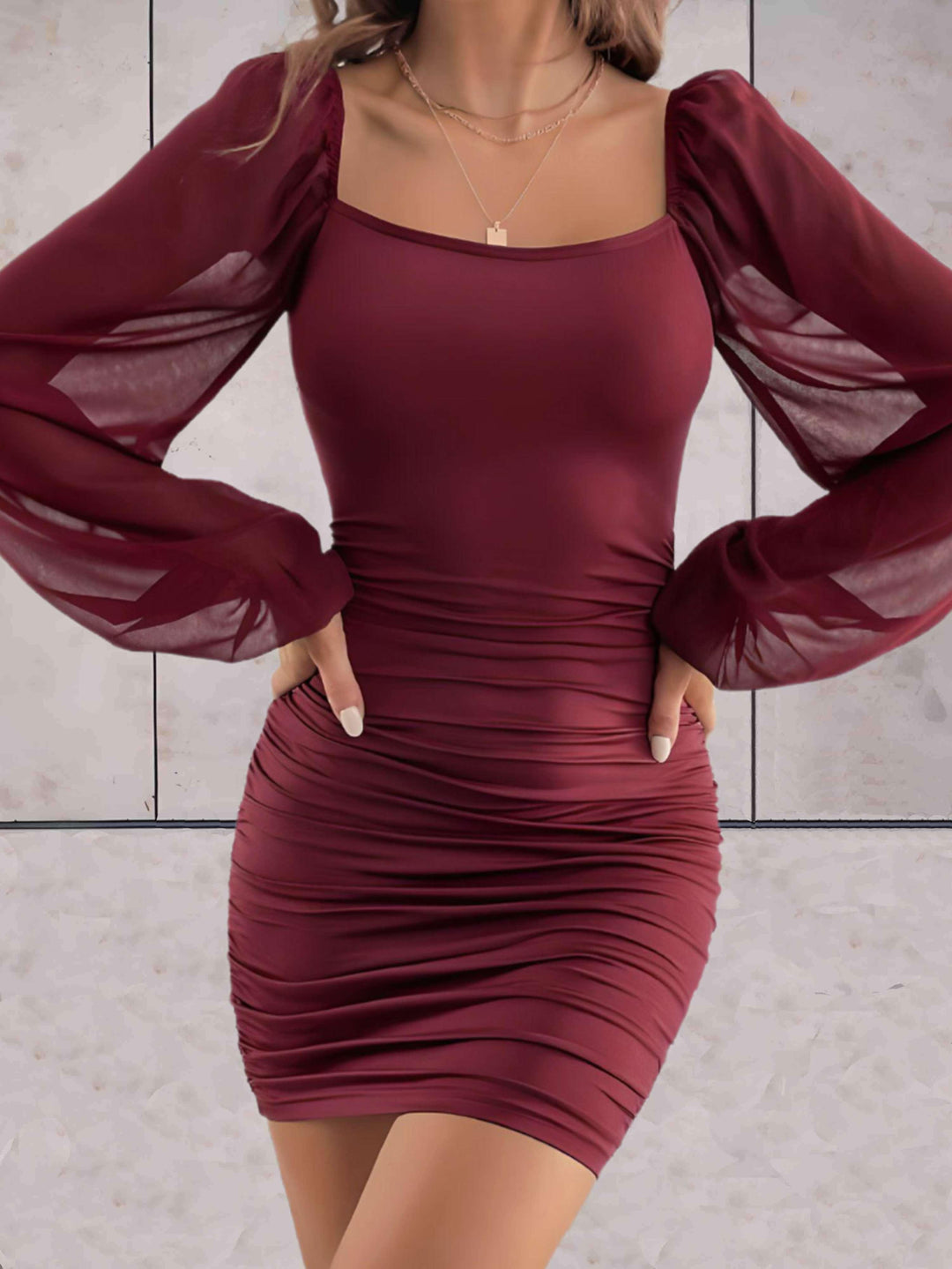 Women's flowy mini dress with wide sleeves, perfect for chic summer style.