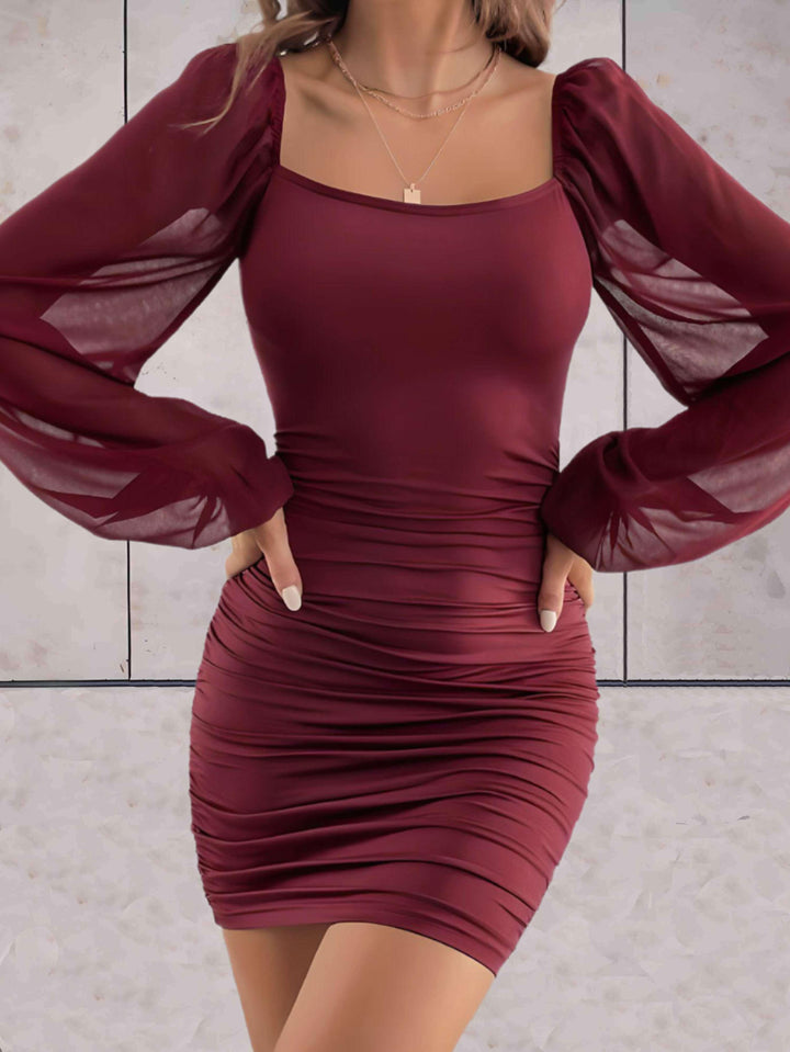 Women's flowy mini dress with wide sleeves, perfect for chic summer style.