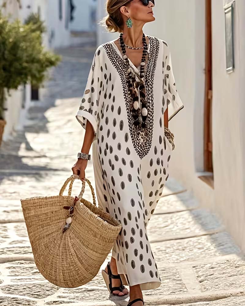 Women's flowy polka dot maxi kaftan dress with intricate embroidery, V-neck, perfect for summer vacation.