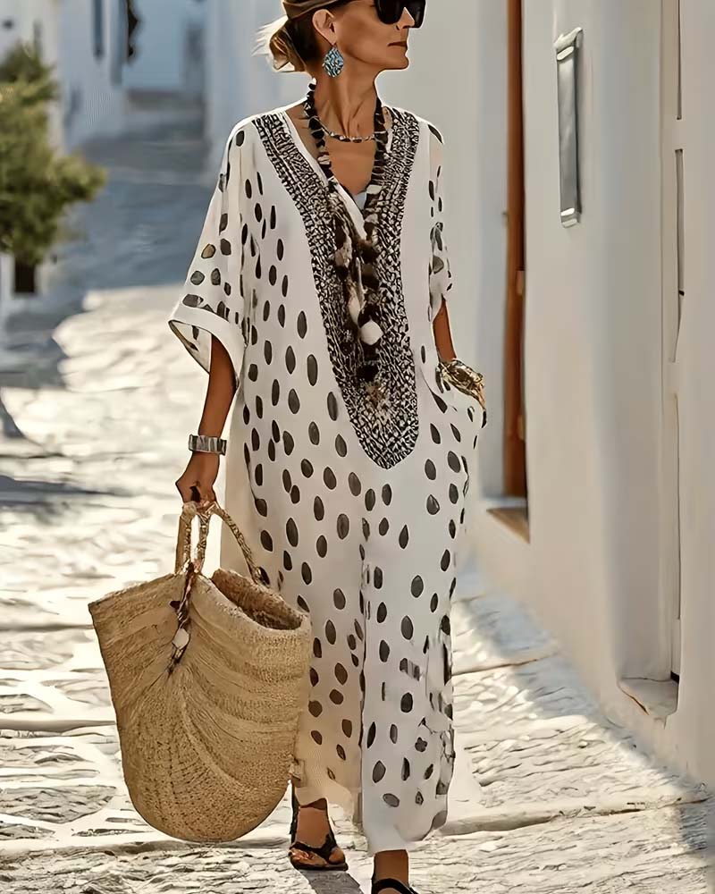 Women's polka dot flowy maxi kaftan dress featuring beautiful embroidery, perfect for beach or casual vacation.