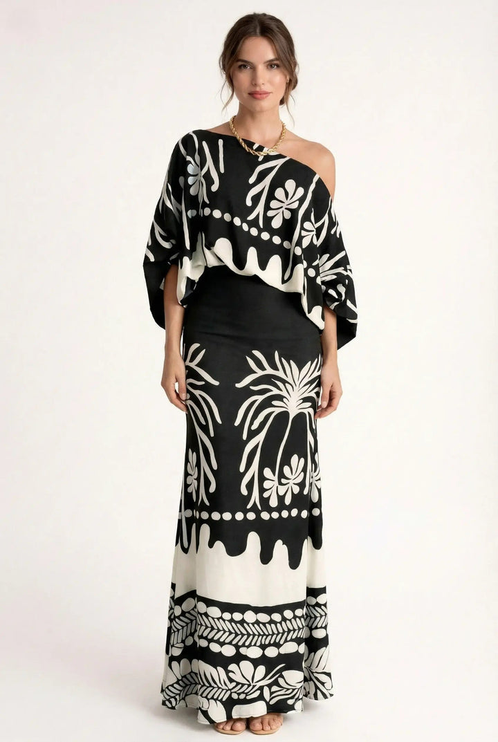Elegant women's printed summer blouse and flowy maxi skirt set, ideal vacation wear with a comfortable relaxed fit.