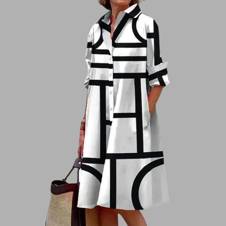 Stylish women's flowy midi dress with vibrant print, offering comfortable and chic everyday wear.