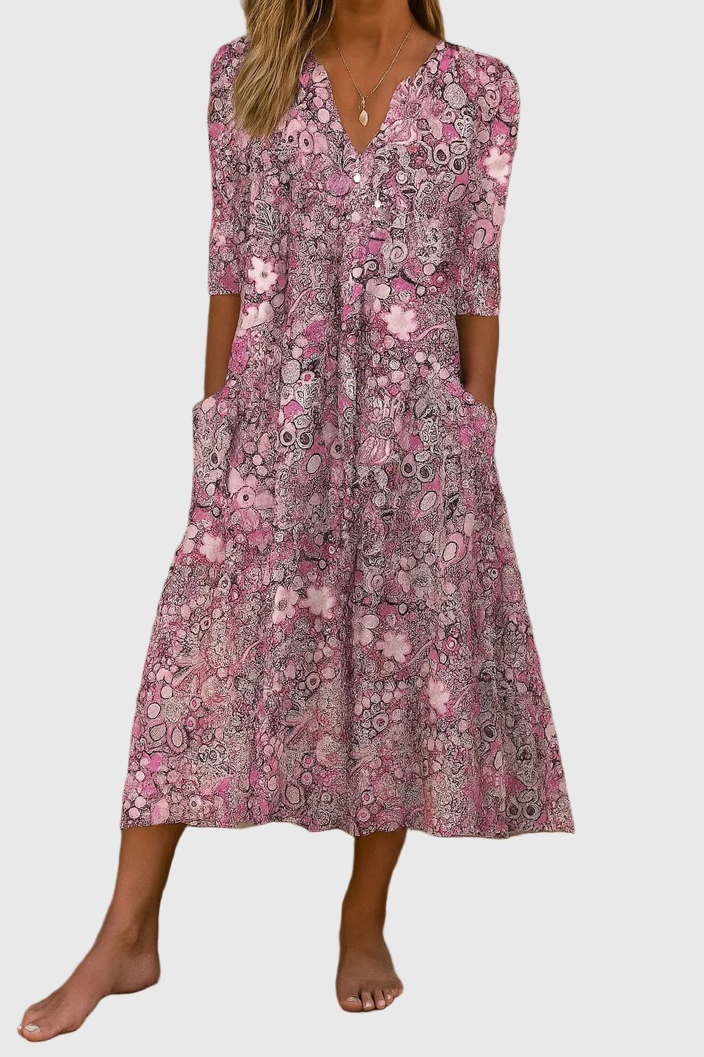 Elegant women's printed midi dress featuring a flattering V-neck, three-quarter sleeves & flowy fabric for spring.