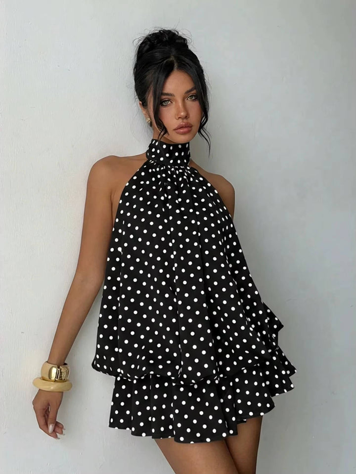 Lightweight women's flowy mini dress, featuring a chic halter neck, ruffle hem & attractive open back.