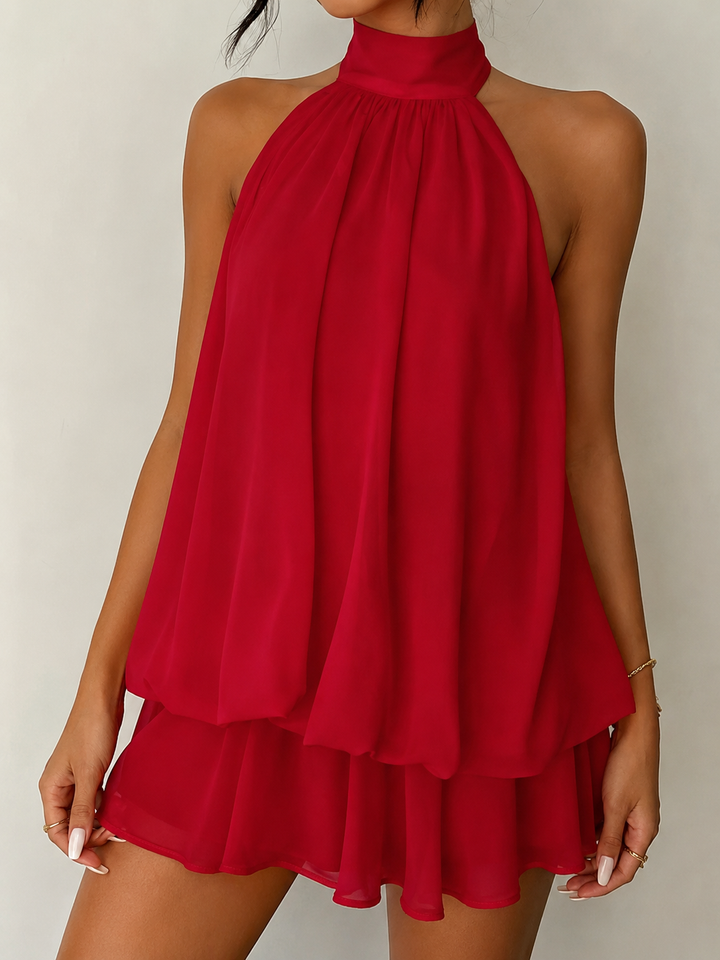 Women's summer fashion halter mini dress, flowy with ruffles & an open back, for warm weather style.