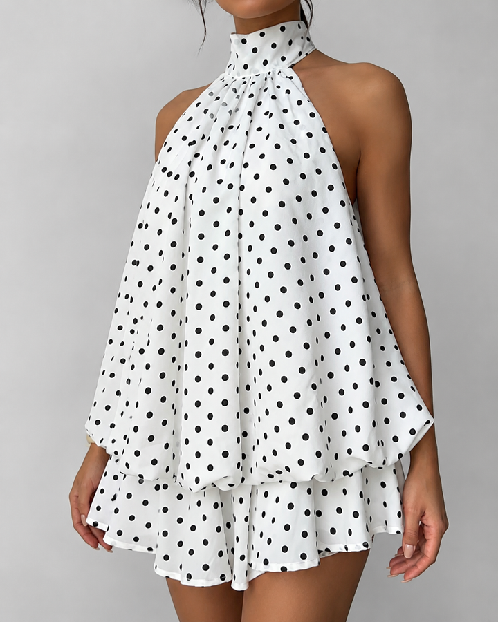 Comfortable flowy trapeze mini dress for women, featuring a stylish halter neck & open back.