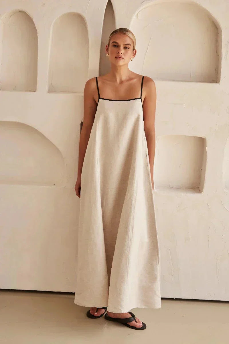Lightweight women's sleeveless beige boho maxi dress, featuring a flowy design & linen-look for comfort.