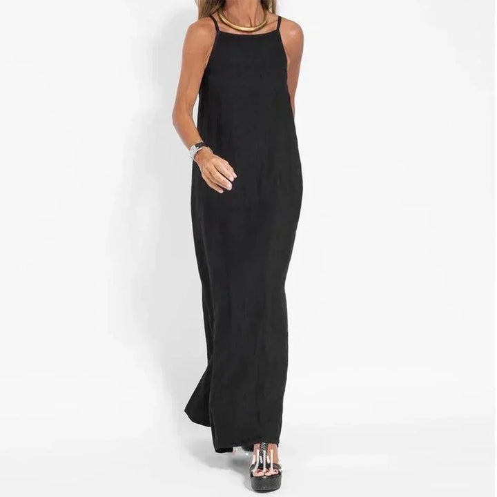 White women's sleeveless flowy maxi dress, perfect for a chic summer vacation or relaxed everyday comfort.