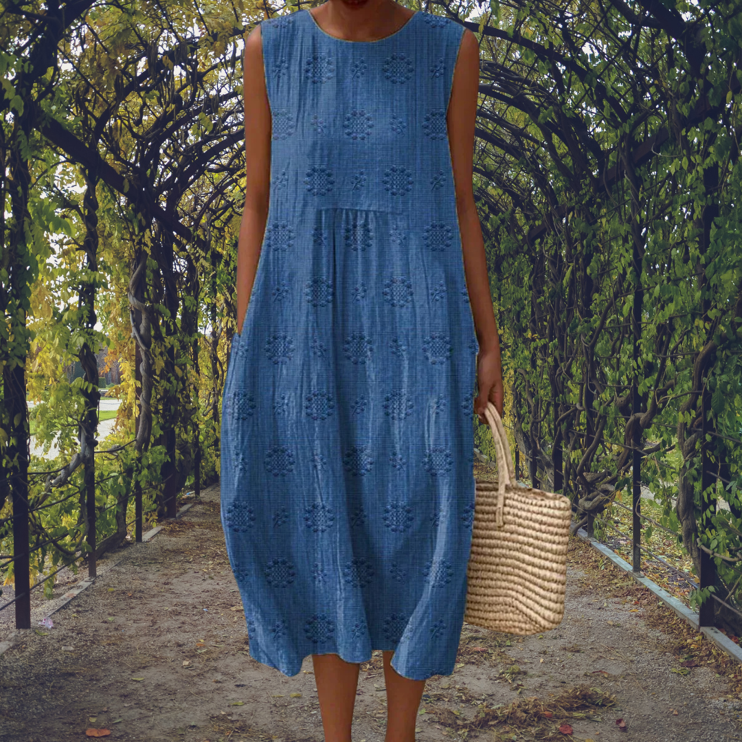 Elegant women's sleeveless midi dress. Versatile flowy style for summer casual or vacation wear.
