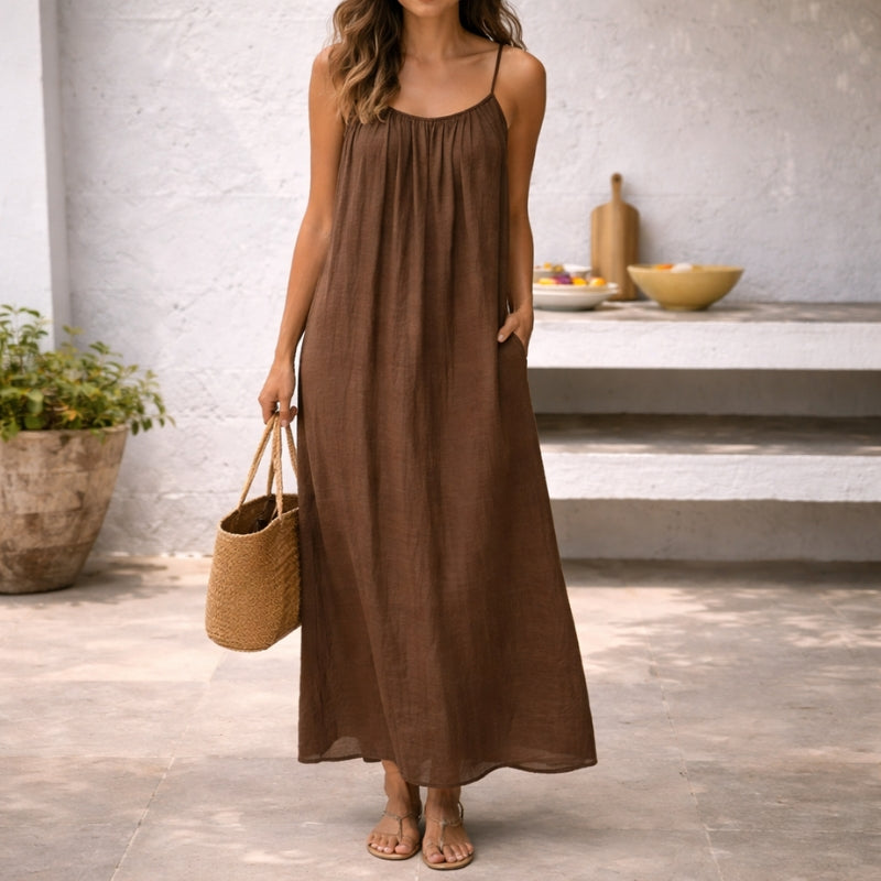 Women's flowy spaghetti strap maxi sundress. Casual summer style, comfortable fit for warm weather.