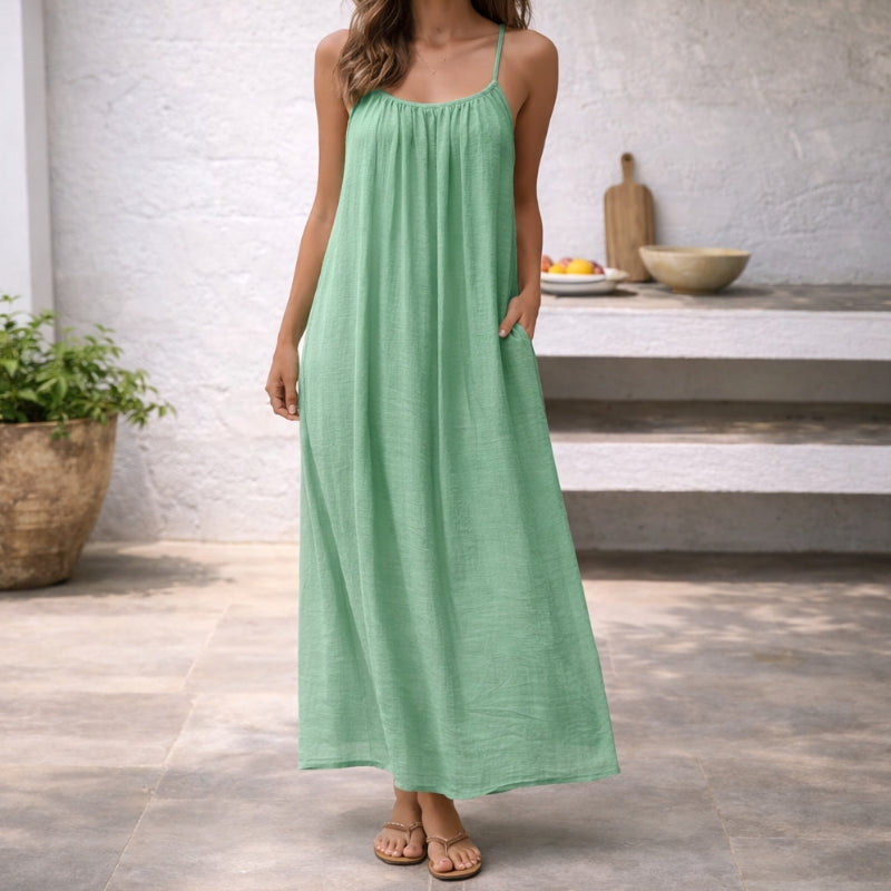 Scoop neck spaghetti strap maxi sundress. Detail of comfortable, elegant neckline for summer style.